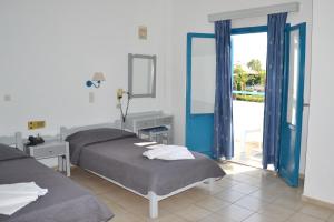 Galeana Beach Hotel tesisinde bir odada yatak veya yataklar