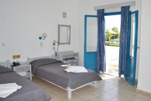 Postel nebo postele na pokoji v ubytování Galeana Beach Hotel