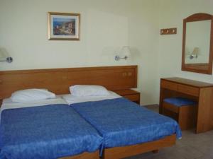 Postel nebo postele na pokoji v ubytování Stella Hotel
