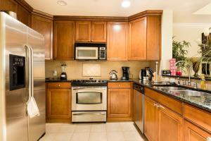A kitchen or kitchenette at Great 3 Bedroom Vacation Apartment with Balcony at Reunion Resort RE1356