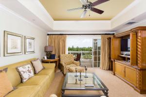 a living room with a couch and a tv at Great 3 Bedroom Vacation Apartment with Balcony at Reunion Resort RE1356 in Kissimmee