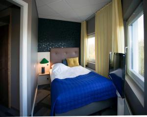 Postel nebo postele na pokoji v ubytování Hotel Lautrup Park