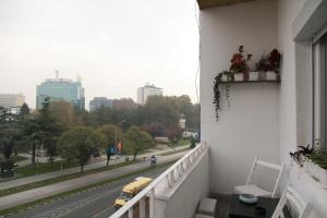 a balcony of a building with a view of a street at Kolev Apartments - Two Bedroom Cozy Central Apartment in Skopje