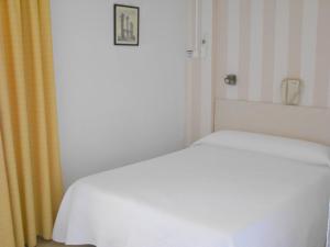 Postel nebo postele na pokoji v ubytování Hotel Tramontana