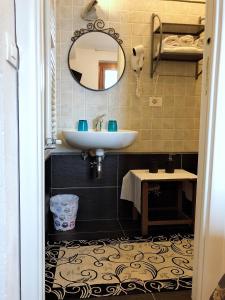 a bathroom with a sink and a mirror at Affittacamere Alle 5 Terre in Monterosso al Mare +30 photos