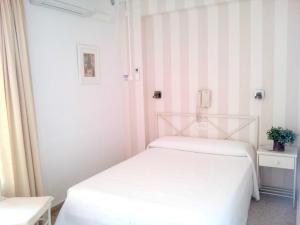Postel nebo postele na pokoji v ubytování Hotel Tramontana