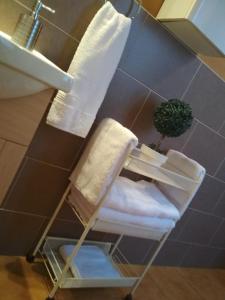 a bathroom with a towel rack and a sink at Los Balcones - Alojamiento Rural en Sigüenza in Sigüenza
