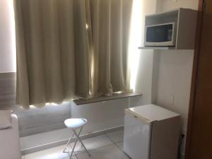 A television and/or entertainment centre at Flat Israel Unidade 308