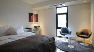 Ένα ή περισσότερα κρεβάτια σε δωμάτιο στο JS Boutique Hotel