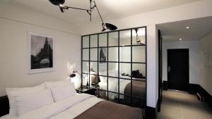 Ένα ή περισσότερα κρεβάτια σε δωμάτιο στο JS Boutique Hotel