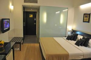 Кровать или кровати в номере Comfort Inn Sunset