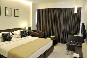 Кровать или кровати в номере Comfort Inn Sunset +37 фотографий
