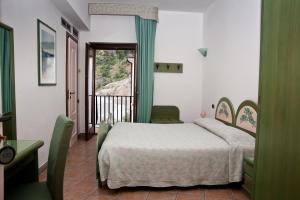 Krevet ili kreveti u jedinici u okviru objekta Hotel Gabbiano