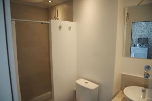 a bathroom with a toilet and a sink and a mirror at Village House in Hora-Pythagorio, Samos Island in Chóra