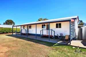 a mobile home with a porch and a patio at Pelican Rest Tourist Park in Saint George