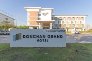 a sign for a durham grand hotel in front of a building at Donchan Grand Hotel in Chiang Mai