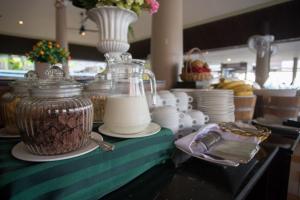 a counter with a jar of milk and other items on it at Sita Beach Resort in Ko Lipe
