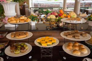a display of different types of bread and pastries on plates at Sita Beach Resort in Ko Lipe