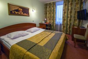 Cama o camas de una habitación en Tourist Hotel