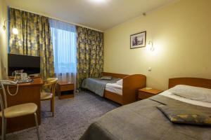 Cama o camas de una habitación en Tourist Hotel