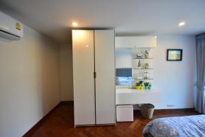 Postel nebo postele na pokoji v ubytování Hua Hin Beachfront Condo