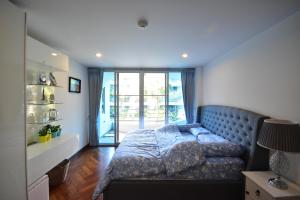Postel nebo postele na pokoji v ubytování Hua Hin Beachfront Condo + 15 fotografií