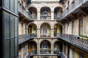 an old building with balconies on the side of it at DownTown Design Flat in Budapest