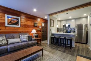 a living room with a couch and a kitchen at La Residence V #S02 Condo in Mammoth Lakes