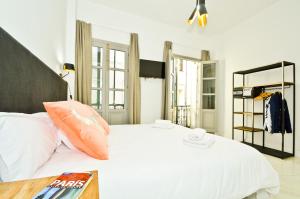 Posteľ alebo postele v izbe v ubytovaní NineSuites