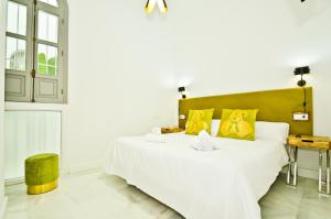 Posteľ alebo postele v izbe v ubytovaní NineSuites