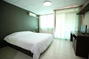 Katil atau katil-katil dalam bilik di De Junction House