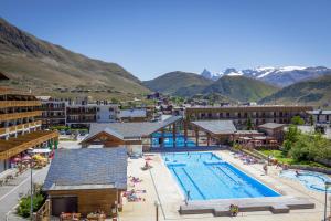 an aerial view of a resort with a swimming pool at Chalet Amandine in L'Alpe-d'Huez