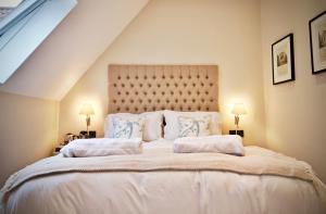 Ένα ή περισσότερα κρεβάτια σε δωμάτιο στο Blacknest Golf and Country Club