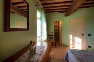 Postel nebo postele na pokoji v ubytování Agriturismo Verniano Five Apartments with Panoramic Pool