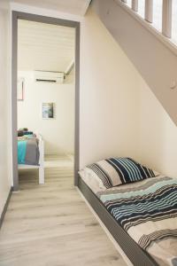 a bedroom with a bunk bed in a room at VILLA SEA AND SURF in Soorts-Hossegor