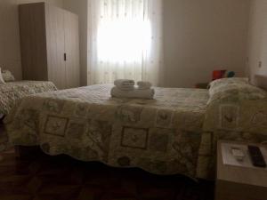 Postel nebo postele na pokoji v ubytování B&B Zia Iaia