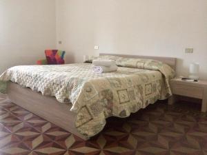 Postel nebo postele na pokoji v ubytování B&B Zia Iaia