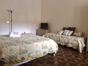Postel nebo postele na pokoji v ubytování B&B Zia Iaia