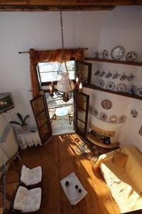 an overhead view of a living room with a room with plates at Traditional studio in Skiros