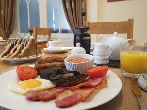 a plate of breakfast food on a table at The Old Parsonage in Brigg