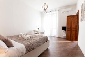 Postel nebo postele na pokoji v ubytování Quattro Canti Charming Flat