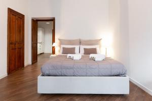 Postel nebo postele na pokoji v ubytování Quattro Canti Charming Flat