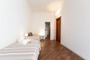 Postel nebo postele na pokoji v ubytování Quattro Canti Charming Flat