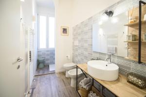 a bathroom with a sink and a toilet at A casa di Stella House in Venezia in Mestre