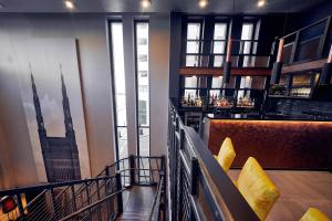 a bar with a view of the shard in a building at Malmaison Liverpool in Liverpool