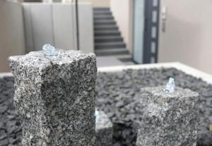 a couple of stone pillars in front of a staircase at Apartment Seven in Ringsheim