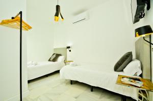 Posteľ alebo postele v izbe v ubytovaní NineSuites