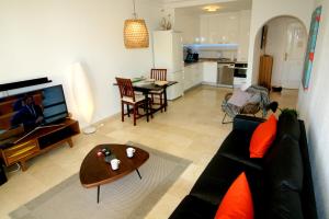 a living room with a couch and a table at Attractive Apartment (PA 4-17) in Estepona
