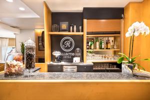 a bar in a restaurant with a counter top at Hotel Mentana, by R Collection Hotels in Milan
