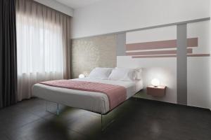 Postel nebo postele na pokoji v ubytování nautilus b&b suite design